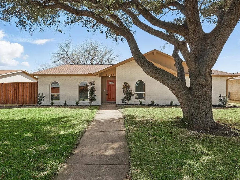 Refreshed exterior with modern paint and landscaping