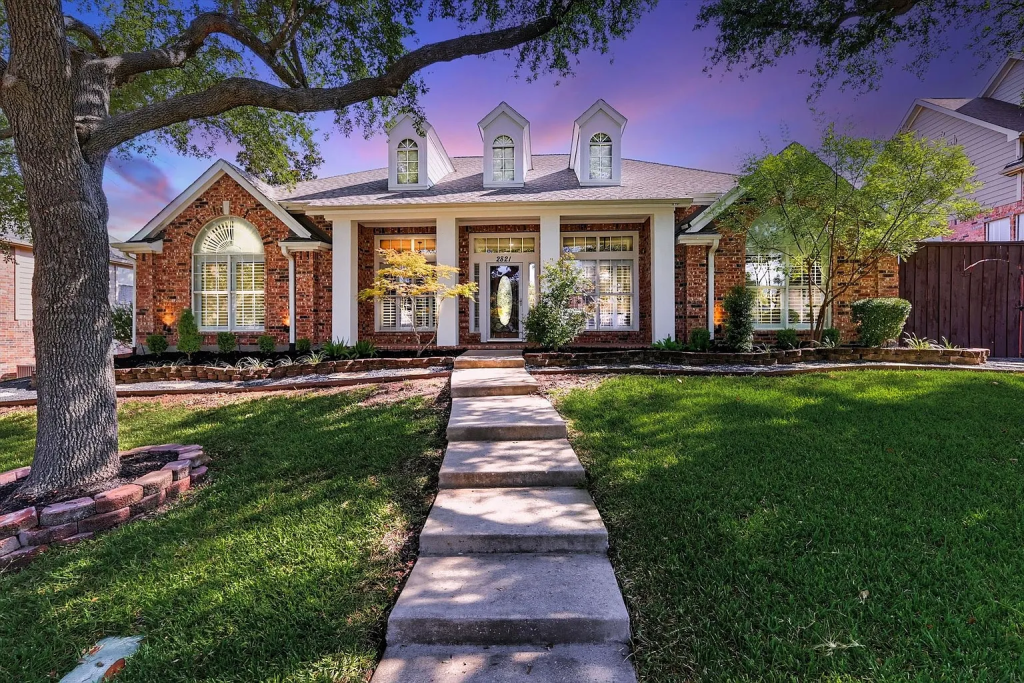 Finished exterior and landscaping at sunset