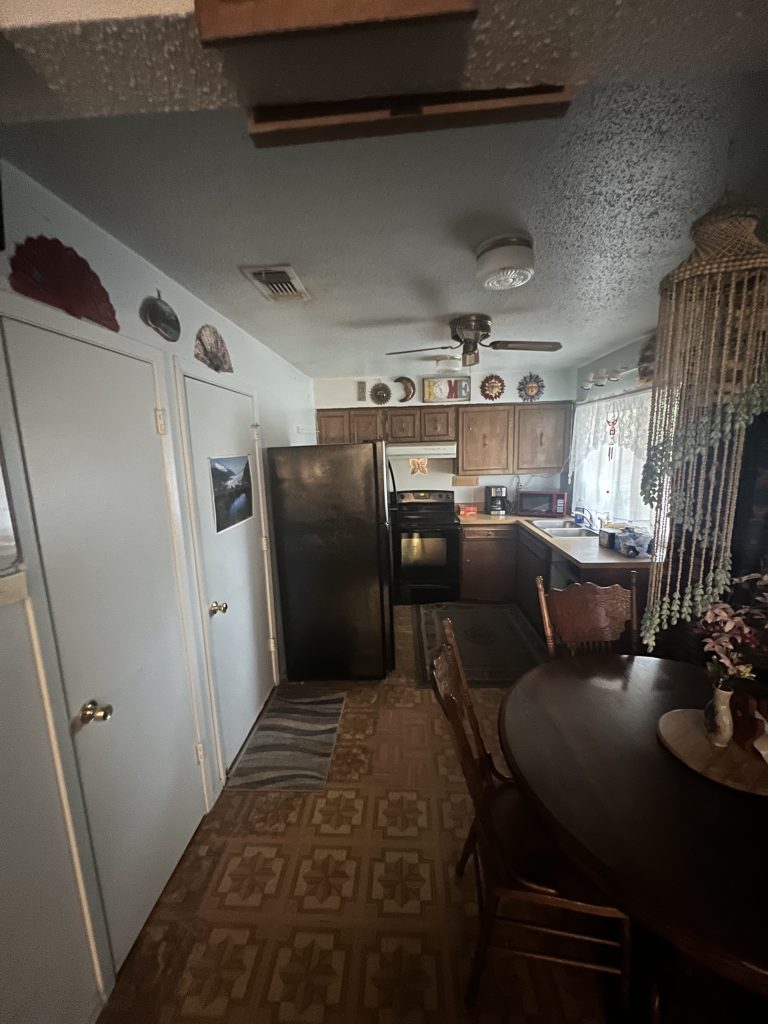 Outdated kitchen with wood cabinets