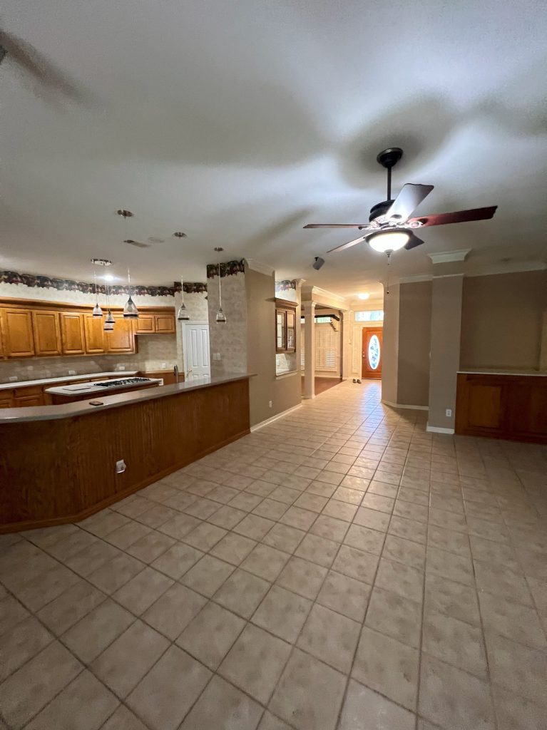 Choppy, dated living room with low ceiling